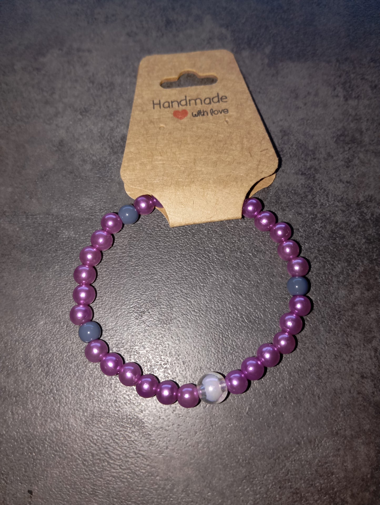 Armband lila mit Kugel